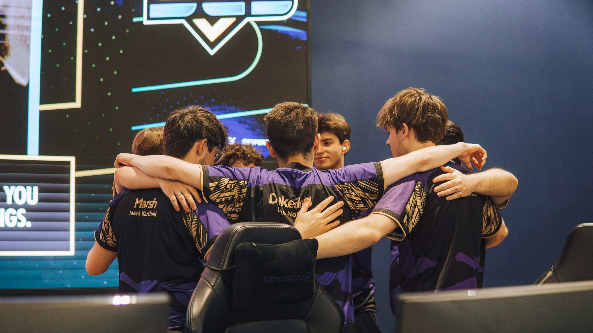 NEL team in a pre-match huddle at a championship event